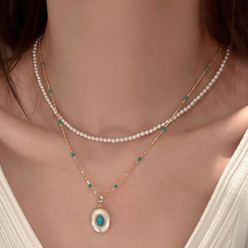 Turquoise-color beaded faux pearl pendant necklace