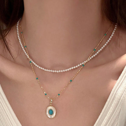 Turquoise-color beaded faux pearl pendant necklace