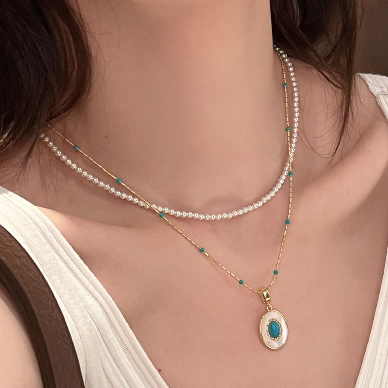 Turquoise-color beaded faux pearl pendant necklace