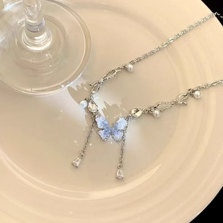Blue crystal butterfly faux pearl tassel necklace