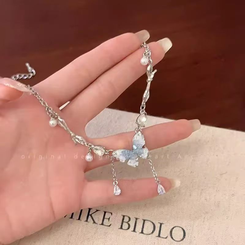 Blue crystal butterfly faux pearl tassel necklace