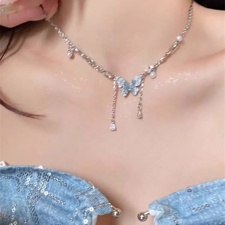 Blue crystal butterfly faux pearl tassel necklace